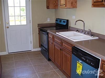 In this photo you can see the new kitchen cabinets solid surface counter tops ceramic tile glass top