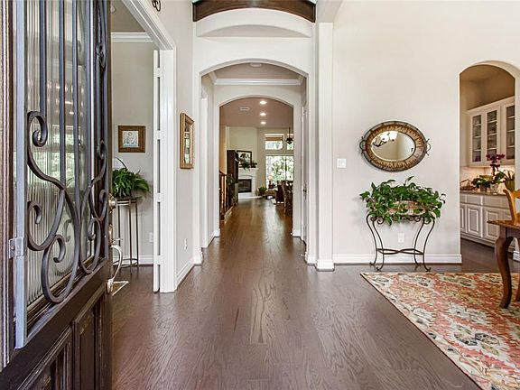 Two story entry with study to the left and formal dining with butler's pantry to the right.