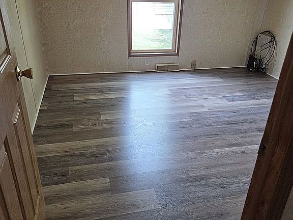 Bedroom with newer wood floo