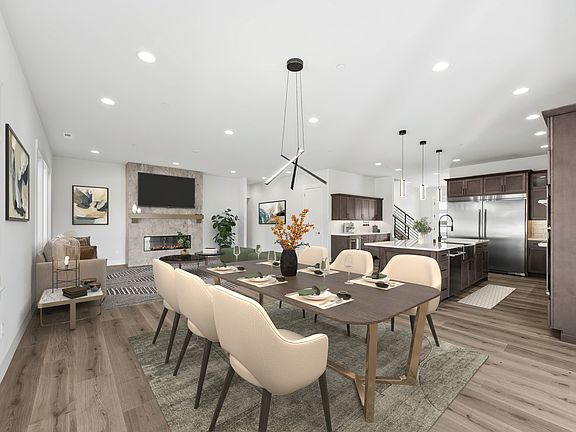 Formal dining with designer lighting fixture
