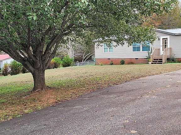 Front yard with paved driveway
