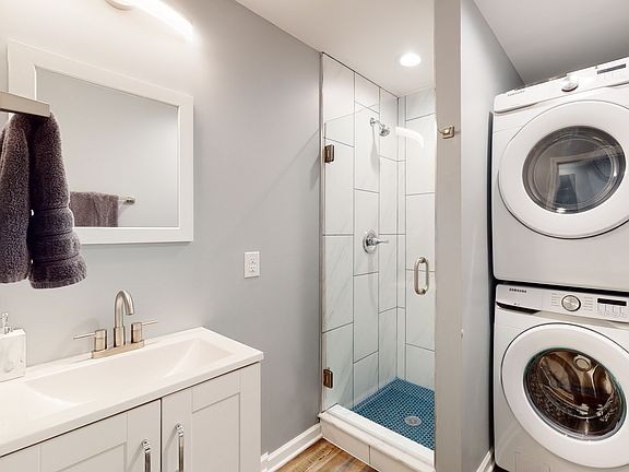 Full Bathroom with full size washer and dryer