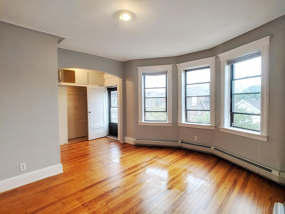 Master bedroom with bay windows, large closet, and private b