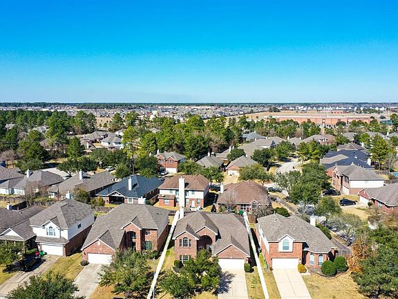 Here is a wonderful aerial view of the home & surrounding community! This home is just a few blocks from Benignus Elementary School which can be seen here in the distance.