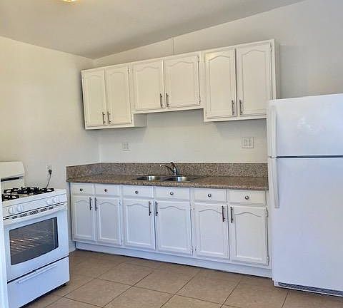 New kitchen cabinets and newer stove/refrigerator
