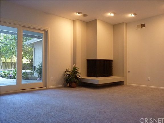 Sunken Living Room With Corner Fireplace