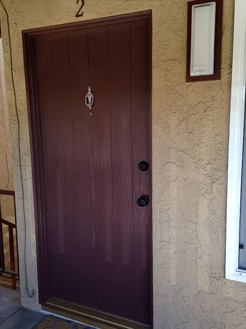 Freshly painted front door with new locks