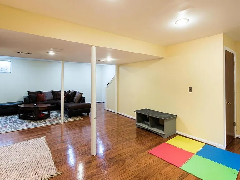 Basement with understairs storage and laundry room