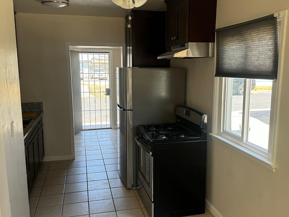 Kitchen with area to have a small table.Back door where landury room is.