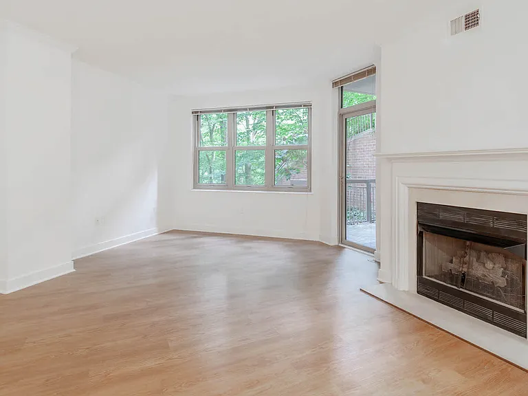 Living Room with Fireplace and Balcony