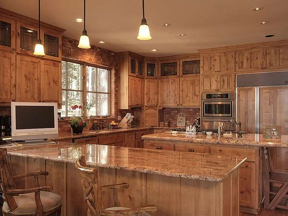 "Open Kitchen with Granite Countertops"
