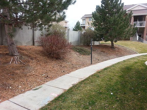 Walkway behind building leading to condo