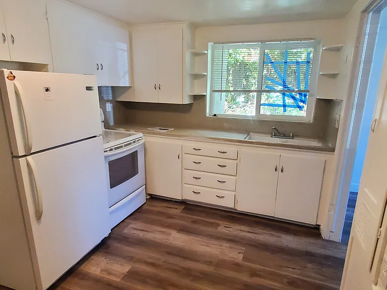 Kitchen does have a table and microwave currently. Photo was taken before move in.