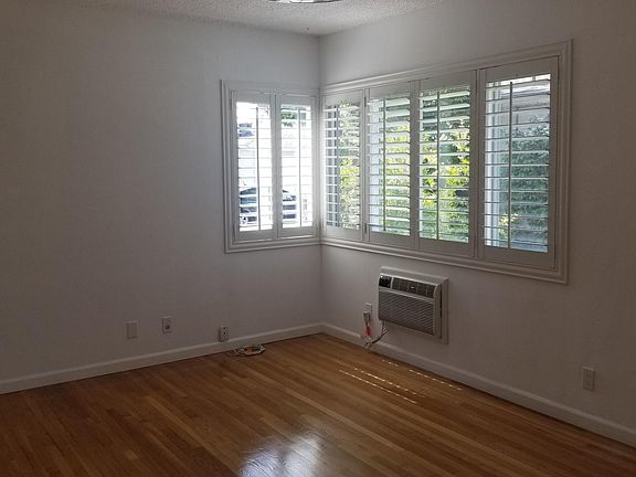 New plantation shutters and thru wall ac unit.