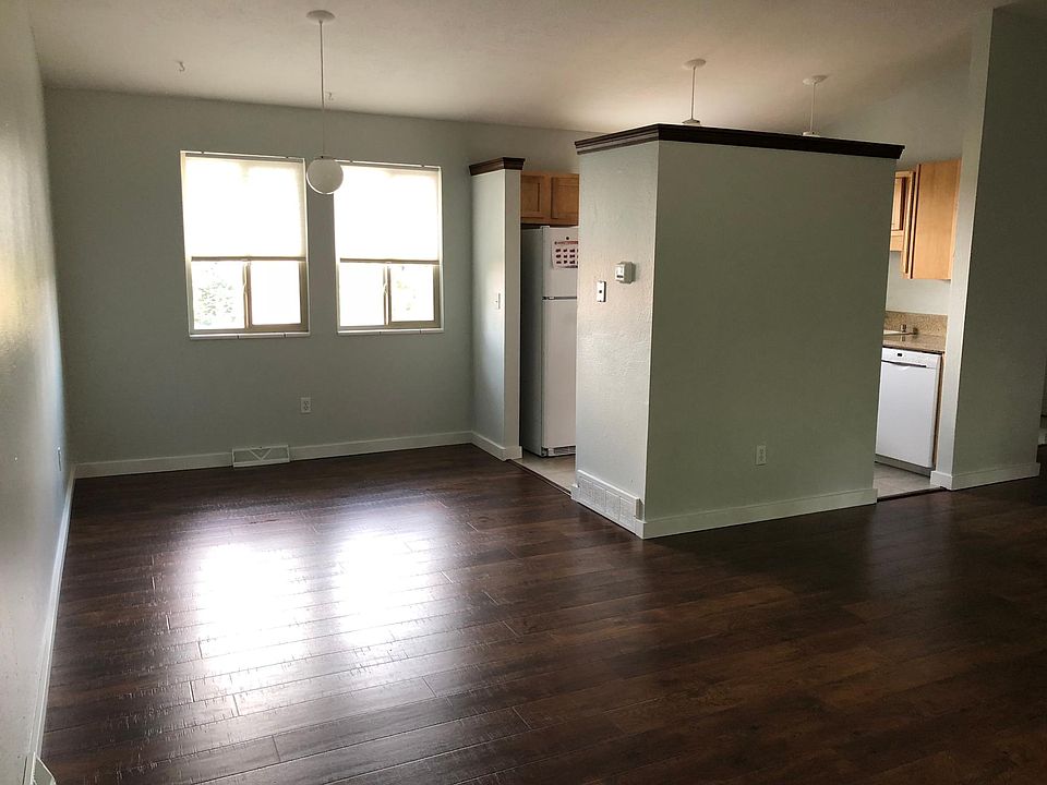 Large open concept dining, living, and kitchen area.