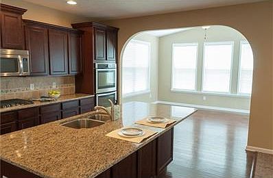Continuing down the hall into the dining room. Beautiful hardwood floors are in various living areas of the home on the main level.