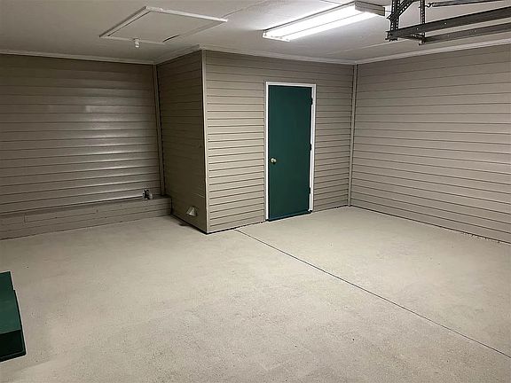 large garage with laundry room