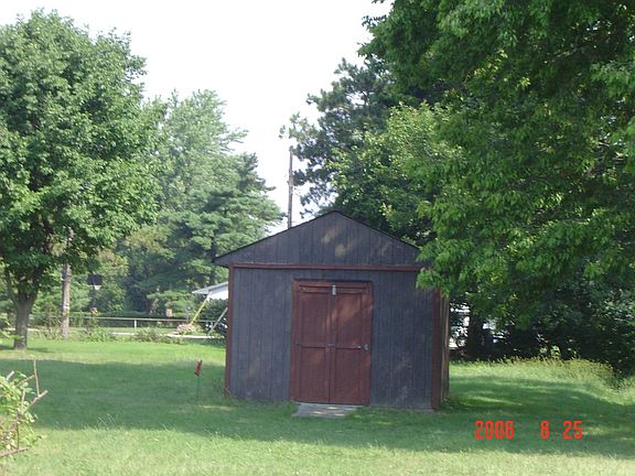 Storage shed on acre lot