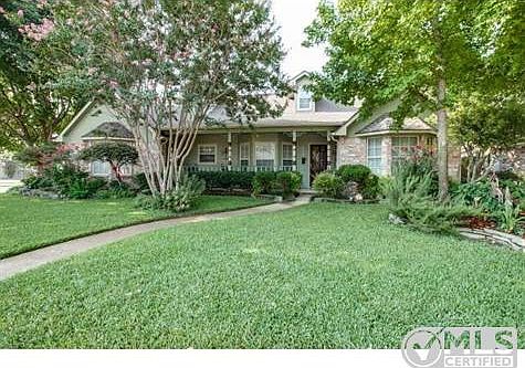 Situated on a corner lot with extensive landscaping