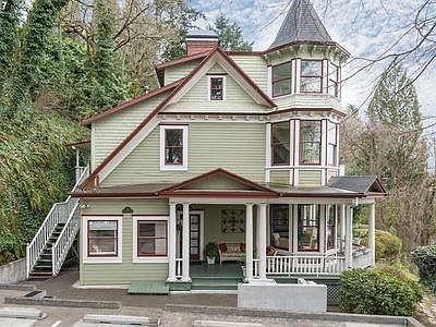 Unit 1 is the lower unit on the ground floor with large wrap around covered porch. View is North towards Mt Saint Helens.