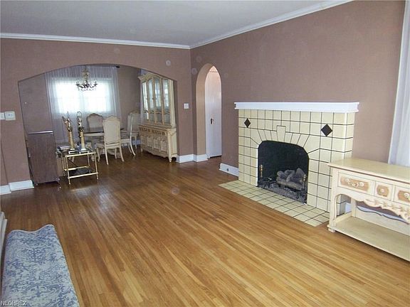 Large 20 x 12 living room with beautiful hardwood floors and gas fireplace