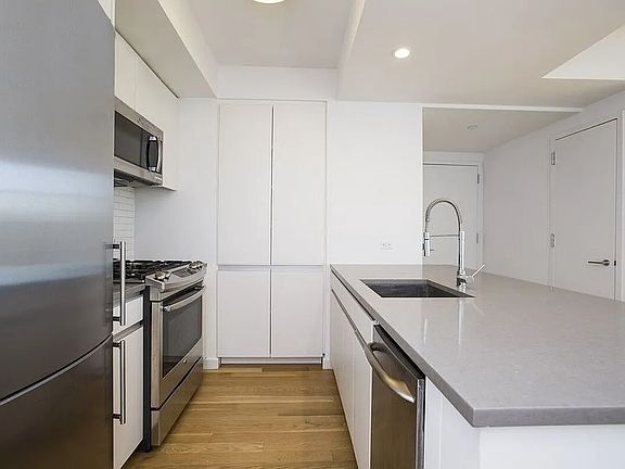 2nd image of 331 E Houston St #Penthouse A
