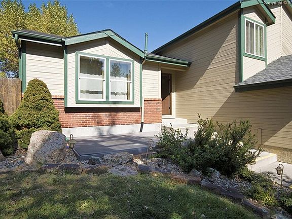 Well landscaped with front composite deck.