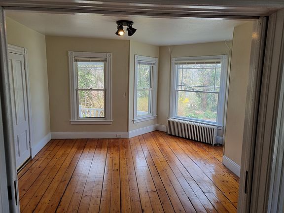 Living room with pocket doors. Could be used as a second bedroom.