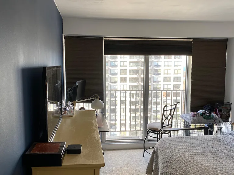 Bedroom looking North with New Paint & New Blackout Blinds. Note small desk area set up beyond chest of drawers.
Navy Blue accent wall now used on both sides of this wall. Other side of wall is living room, where some set up AV equipment, etc.