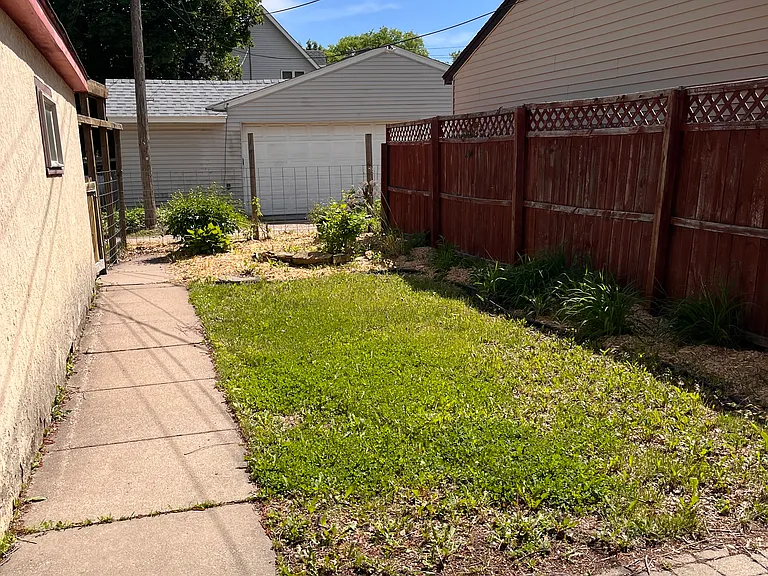 Backyard is partially fenced in, a patio and back porch for each unit with private entryways.