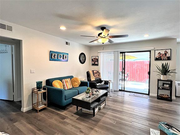 Living room viewed from entry. Access to bedrooms on the left.