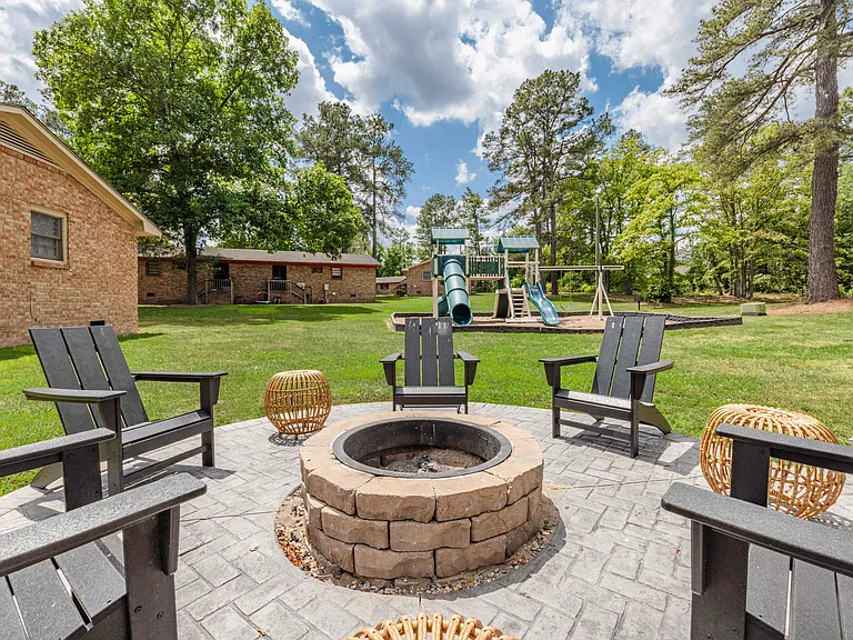 Fire pit with seating at Villas at North Point and South Point Apartments