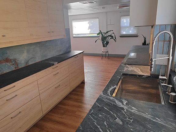 New cabinets, counters, and backsplash.