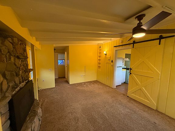Master bedroom has a gas fireplace and remote controlled ceiling fan with lights