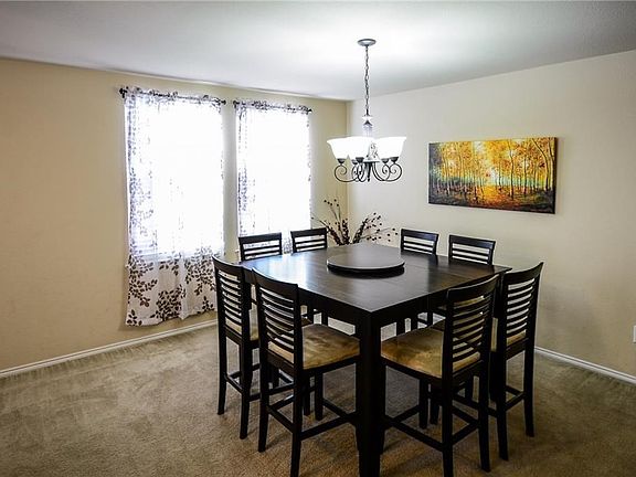 Light and bright formal eating area.