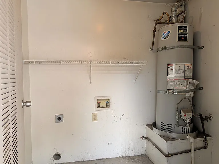 Private laundry room with space for side-by-side washer and dryer