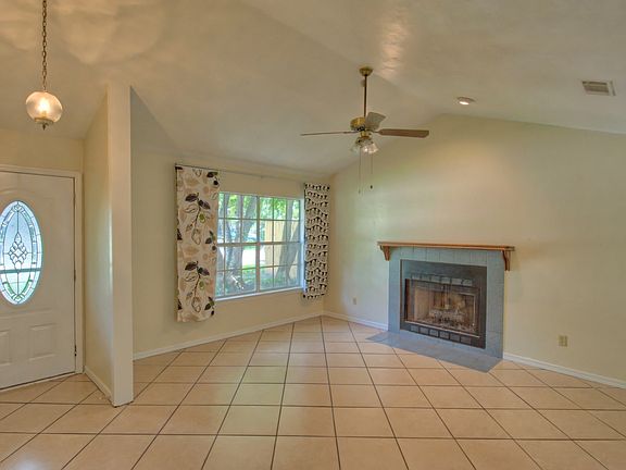 Front door, living room and gas fireplace