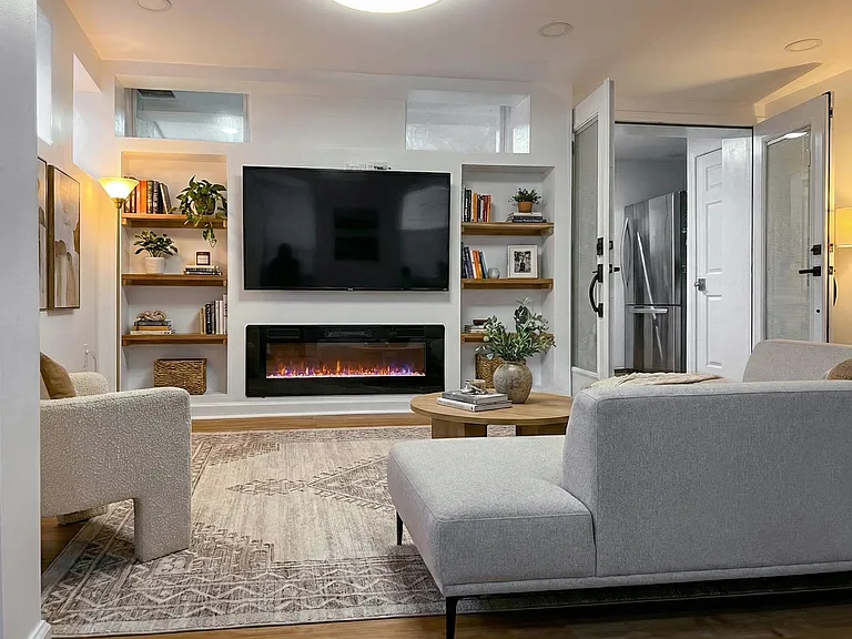 Enclosed three-season room featuring windows, ceiling fan, and a clean, comfortable layout.