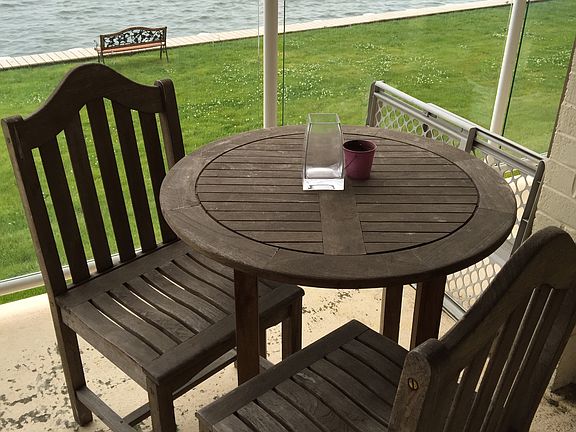 Teak furniture setup on the private patio
