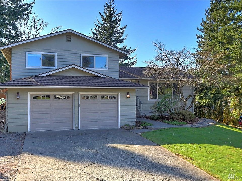 Welcome Home to Candlewood Ridge. This 3 bedroom, 3 bath home sits on a sweeping corner lot in a well-established neighborhood.  Enjoy connecting with guests in the open concept living and dining rooms. The kitchen features off white cabinets and a breakfast nook that overlooks the lower level family room. On the main level you'll also have access to a two-tiered deck equipped with wiring for a hot tub. Extend your living and entertaining spaces outside to the large fenced backyard,  shed and tiered garden beds. Recent updates are sure to please--hardwood flooring through-out the main level, new carpets, white doors, newer double paned windows, updated baths and more make this a "can't-miss" property.  Warm yourself by the wood burning fireplace in the family room which features architectural nooks and access to the outside decks. A large utility room features plenty of storage and half bath.