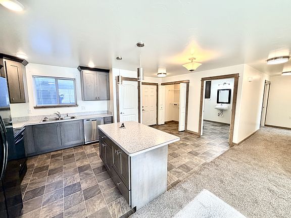 Open floor plan for kitchen, dining room and living room.