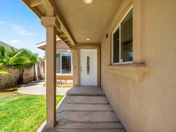 Step into comfort and style through our welcoming front entrance, where modern charm meets inviting ambiance, promising a delightful stay.