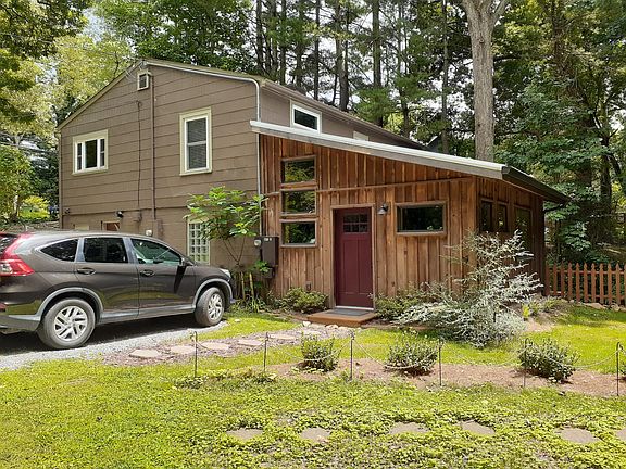Attached to owner's home (retired Asheville teacher) with no shared spaces or doors. There is one dedicated parking space for the unit.