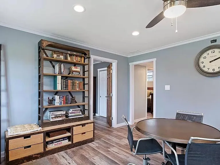 More of 2nd living area/family room. stairway and 2nd bedroom through door to right, office or 3rd bedroom through door to left
