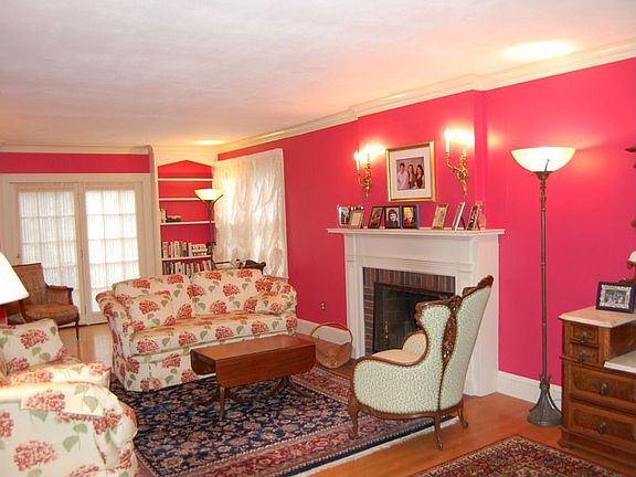 Living room with french doors.Walk out to the deck. Enjoy the fireplace on a cold winter night. buil