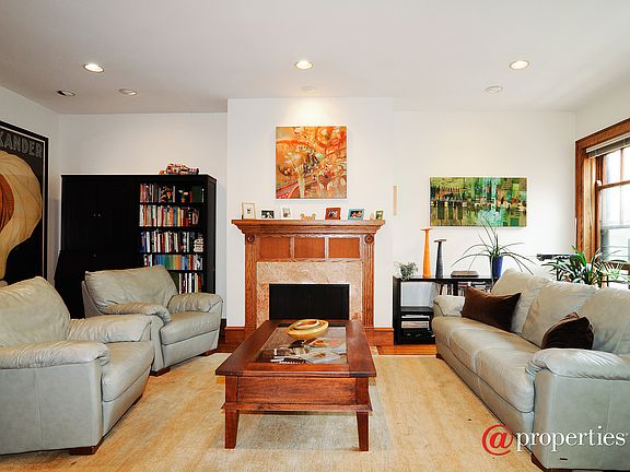 sun filled living room w/wood burning fireplace