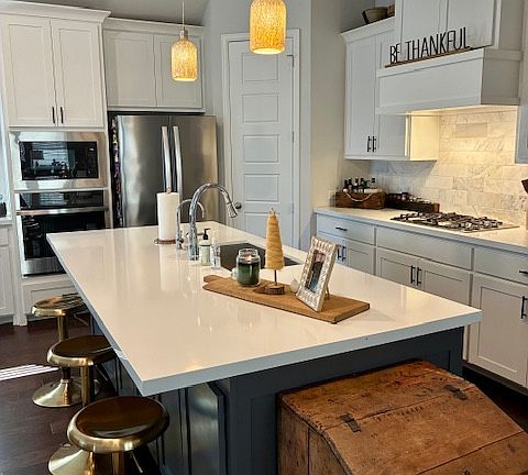 Open Kitchen with Huge Island and Gas Stove.