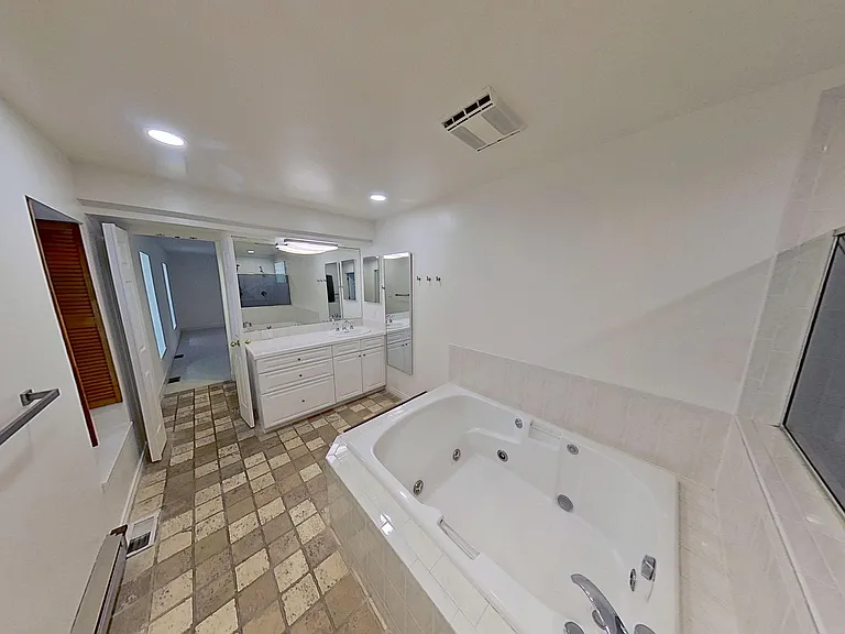 Master Bathroom Jacuzzi tub with his & her sink areas