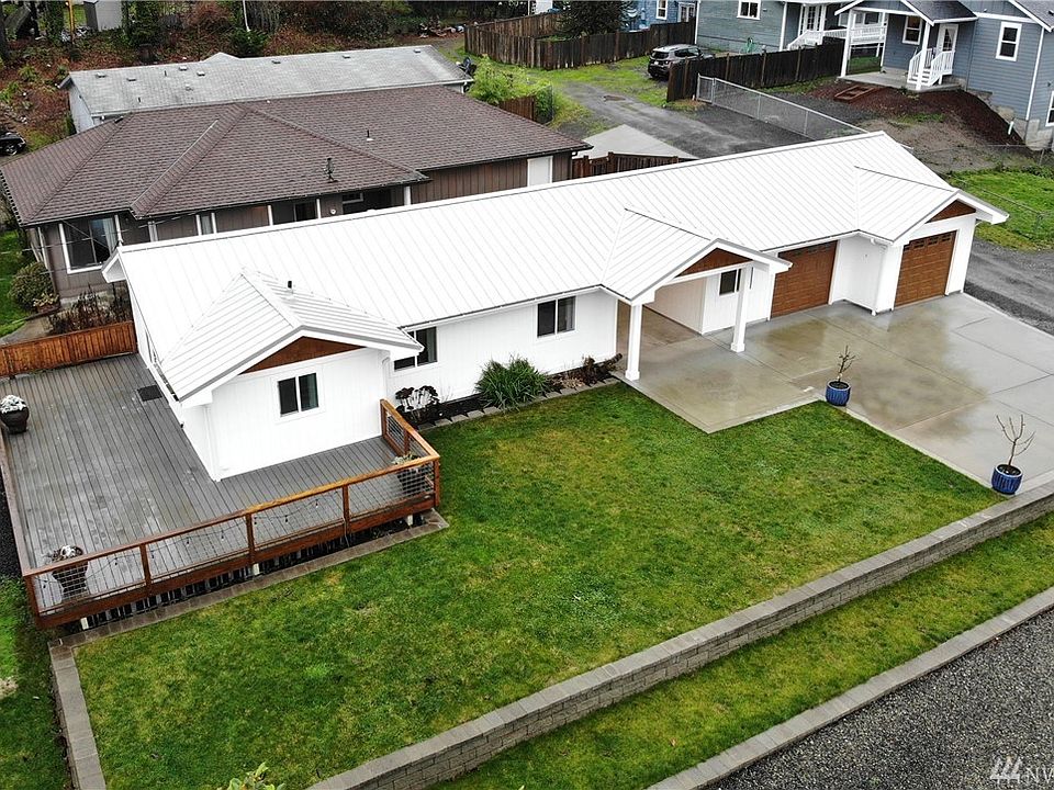 Welcome Home!  Covered breezeway provides convenient path to the oversized insulated garage.