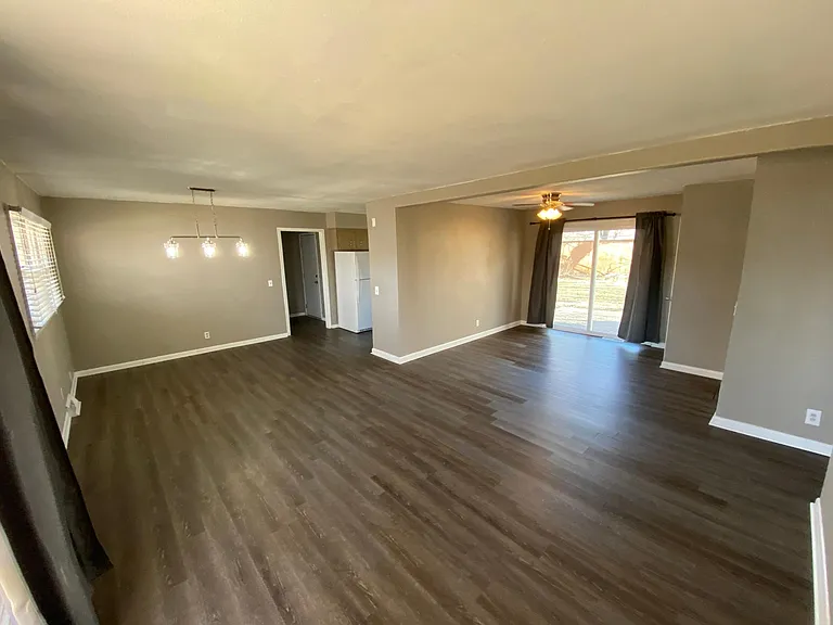 Modern light fixtures and flooring throughout.